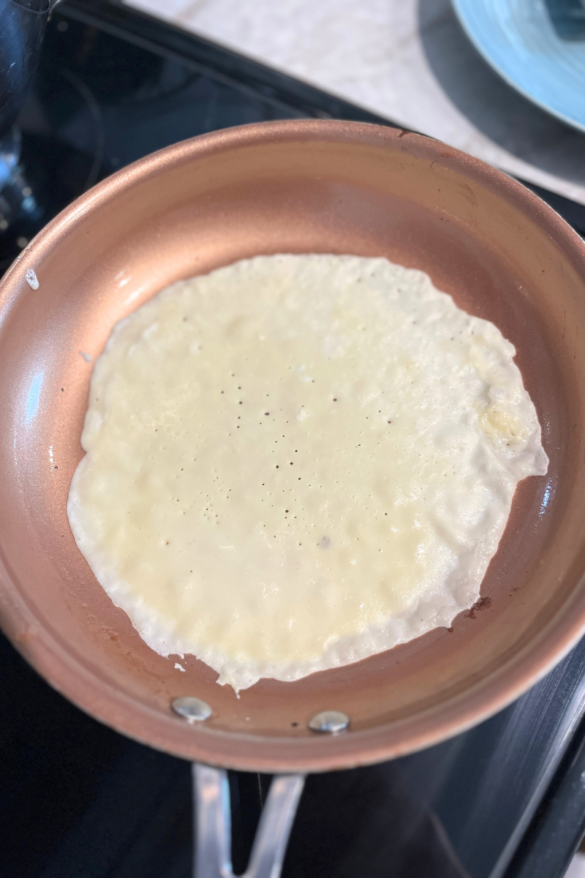 Frying crepes.