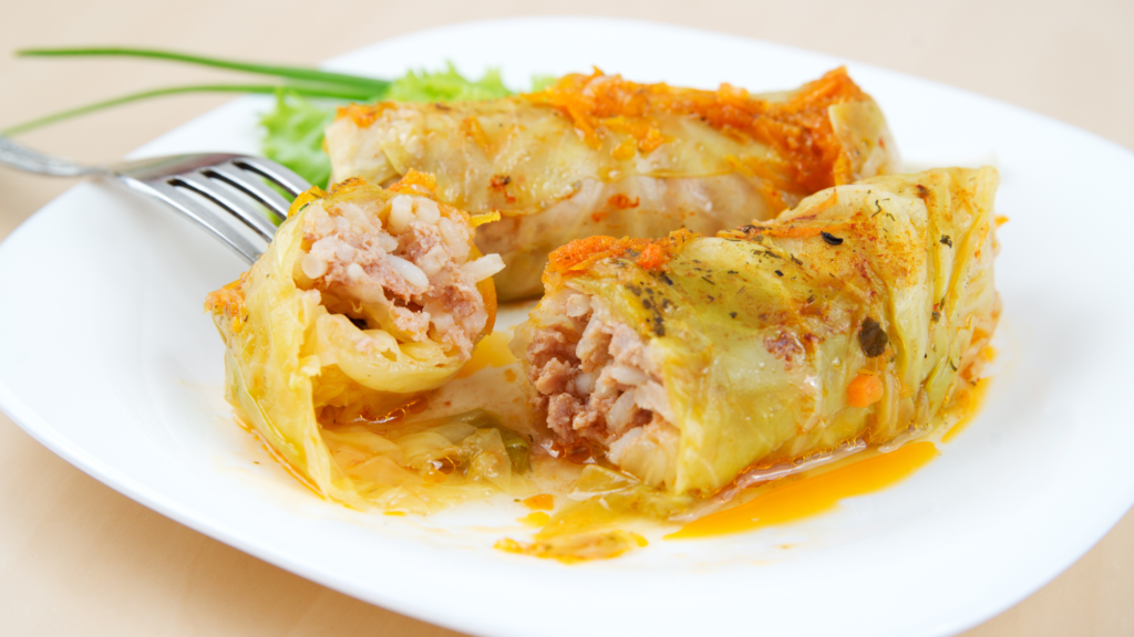 cabbage rolls cut open with a fork