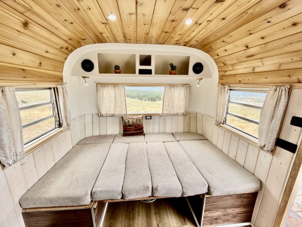 1972 streamline travel trailer dinette folded with all the cushions making a large comfy bed. 