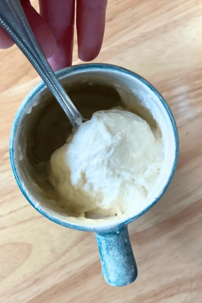 Mixing baking soda with sourdough starter for pumpkin spice bars — activating the starter to create fluffy, soft sourdough dessert.