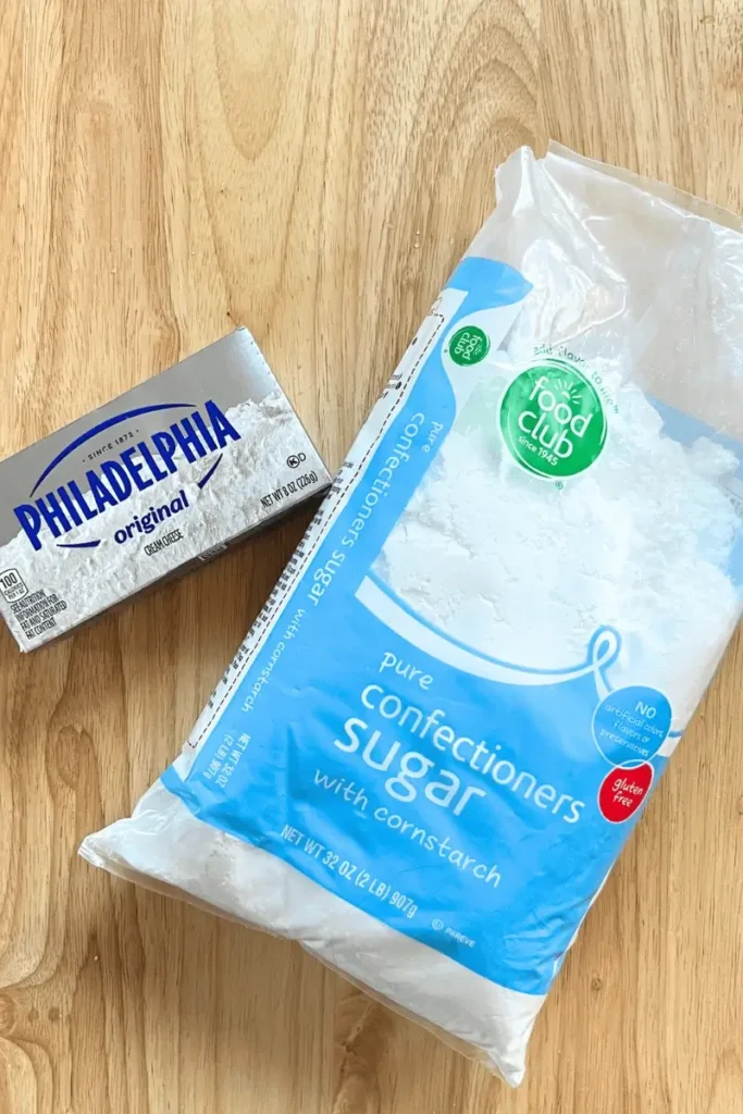 Cream cheese frosting ingredients for sourdough pumpkin spice bars — softened cream cheese, and powdered sugar.