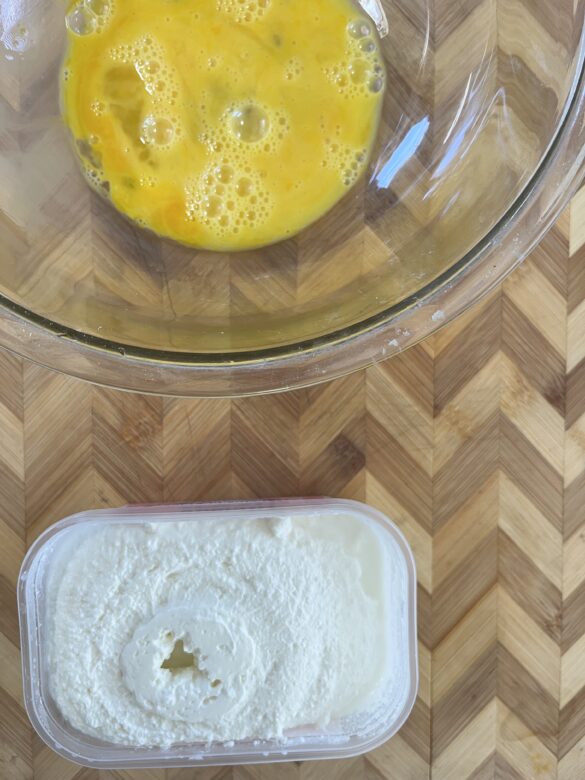 Cottage cheese and beaten eggs for sourdough cottage cheese pancakes.