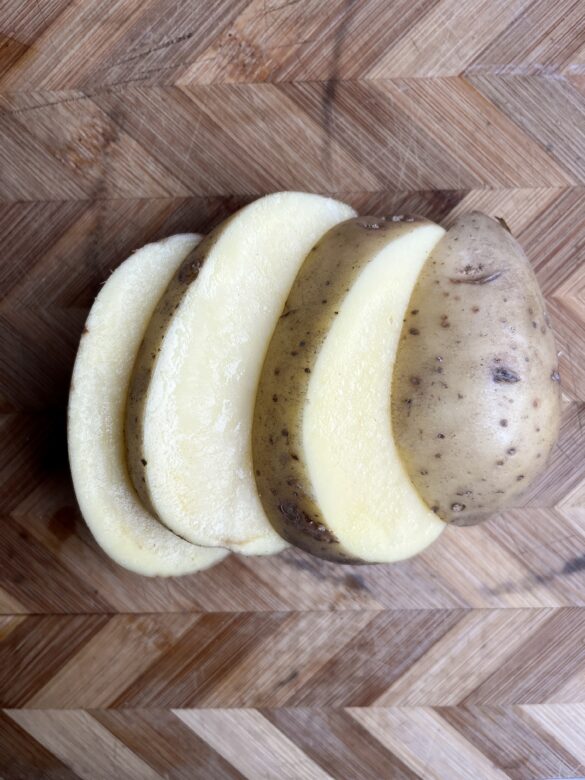 Gold Yukon Potato cut in 4 pieces.