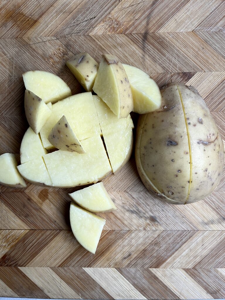 Gold Yukon Potato cut into pieces.