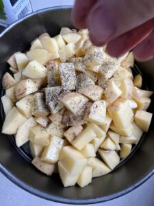 Potato with salt and pepper for oven roasted potatoes.