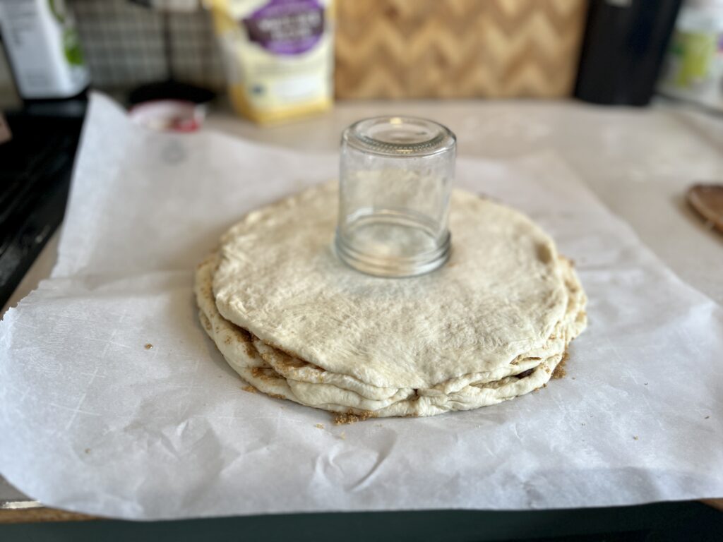 Sourdough cinnamon star dough layered with a glass jar in the middle.