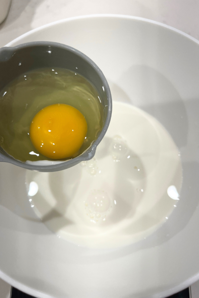 Eggs and milk in a bowl.