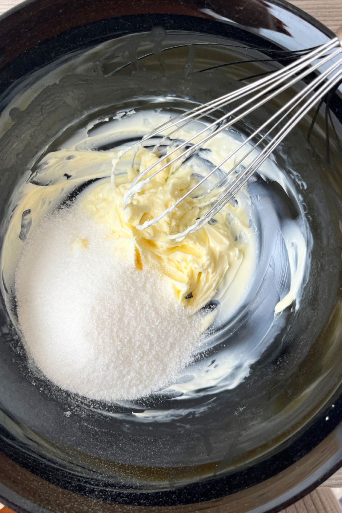 Butter and sugar in a bowl. 