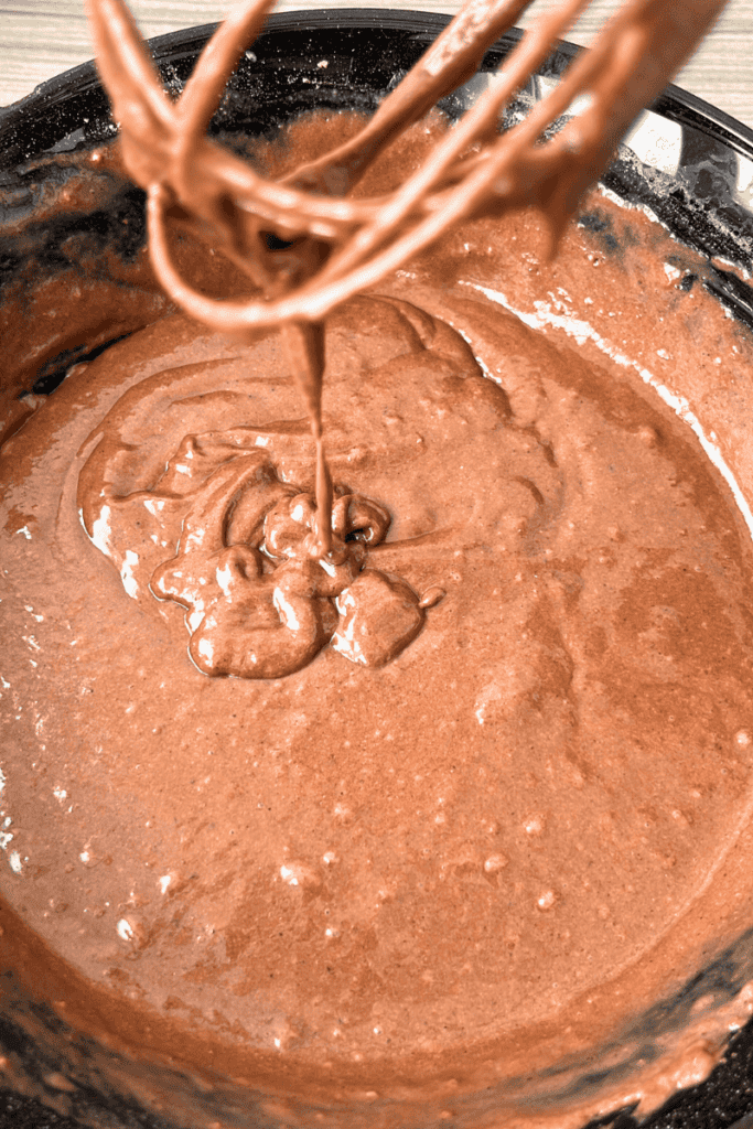 Sourdough chocolate cake batter mixed in a bowl.