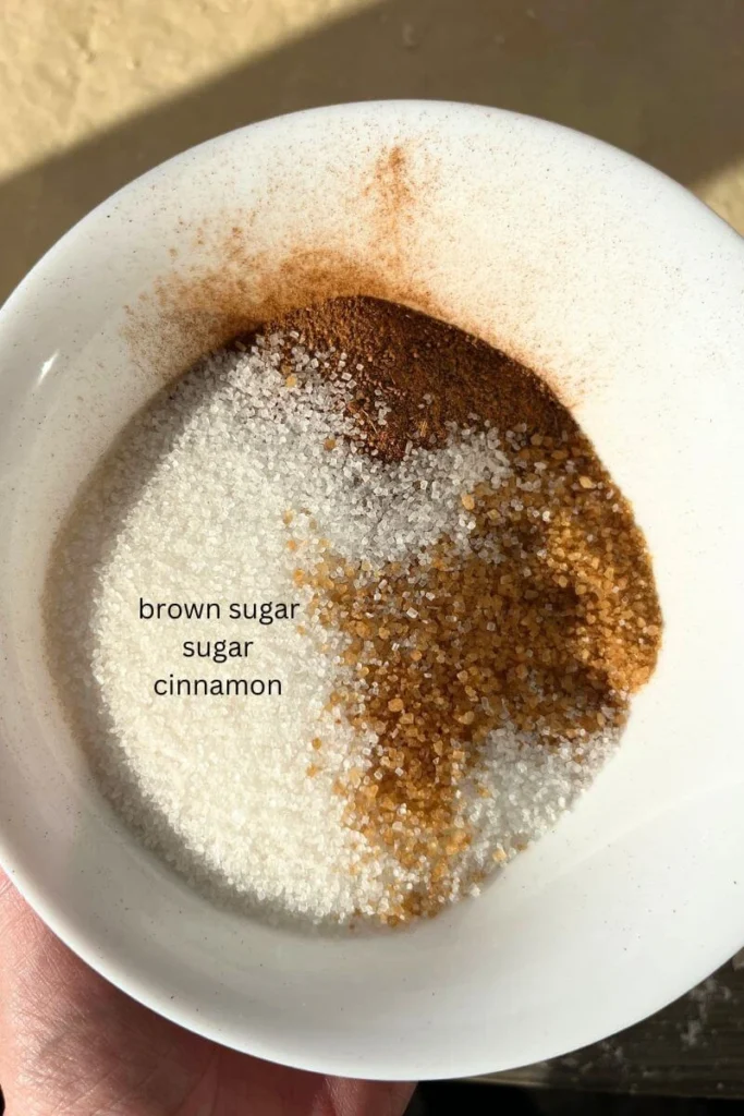 Brown sugar, sugar, and cinnamon in a bowl.