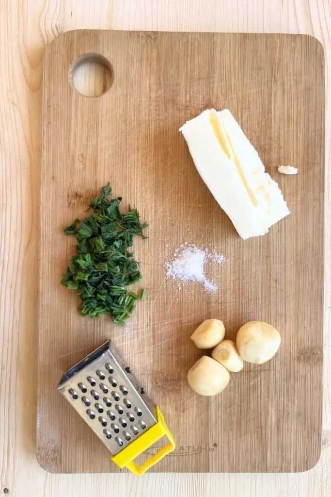 Sourdough garlic knots ingredients on a cutting board. 