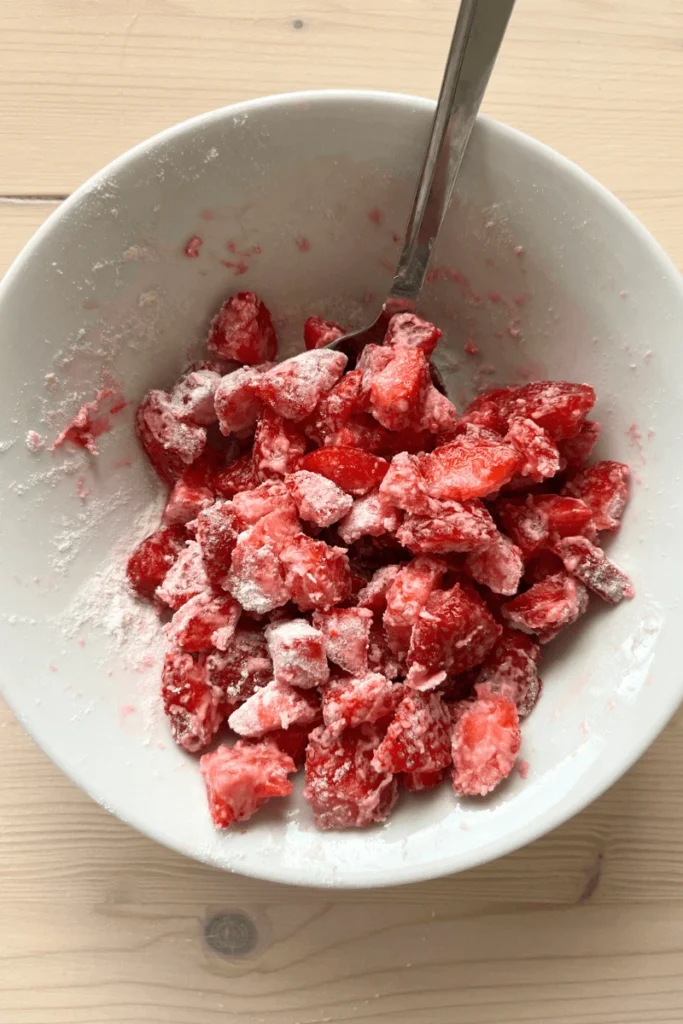 Strawberries coated in flour for baking Strawberry Sourdough Scones (or Biscuits!)