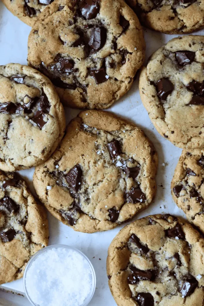 Sourdough Chocolate Chip Cookies on a parchment paper. 