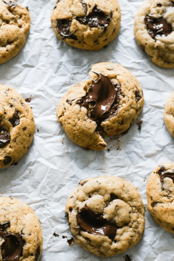 Sourdough Chocolate Chip Cookies on parchment.