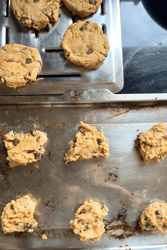 Soft & Chewy Sourdough Peanut Butter Chocolate Chip Cookies on a baking sheet ready to be baked. 