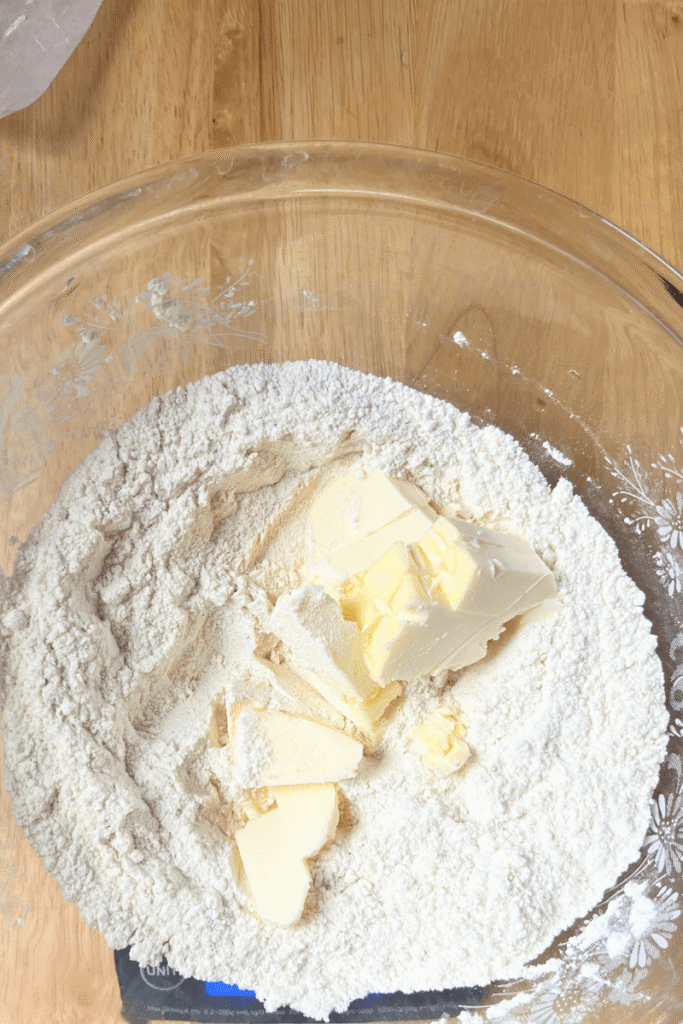 Cutting cold butter into the dry ingredients.