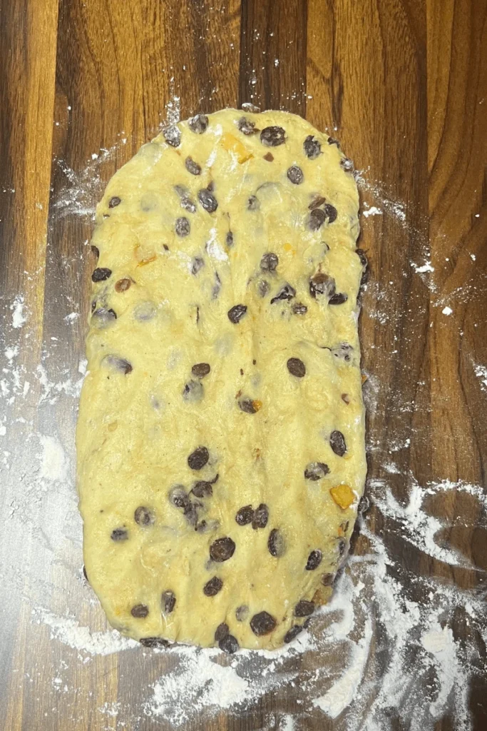 Sourdough stollen bread shaped into an oval.