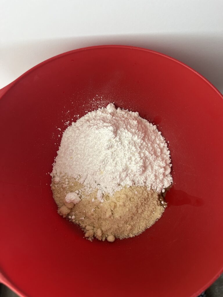 Almond flour with powdered sugar to make homemade marzipan roll.