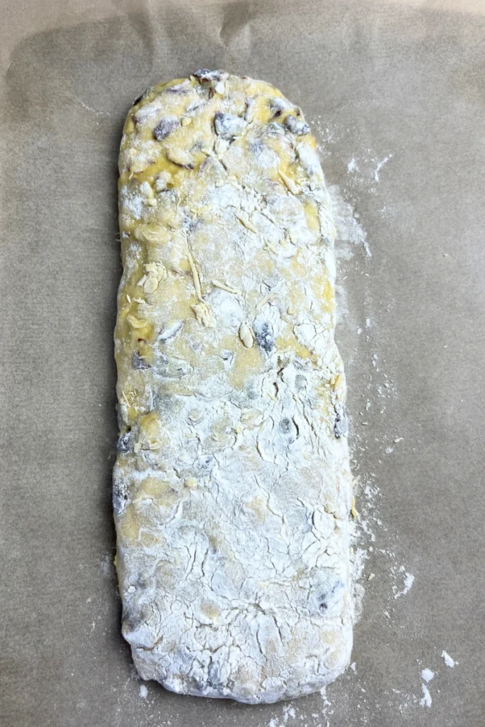 6 Shaping sourdough cranberry almond thins dough into logs before baking.