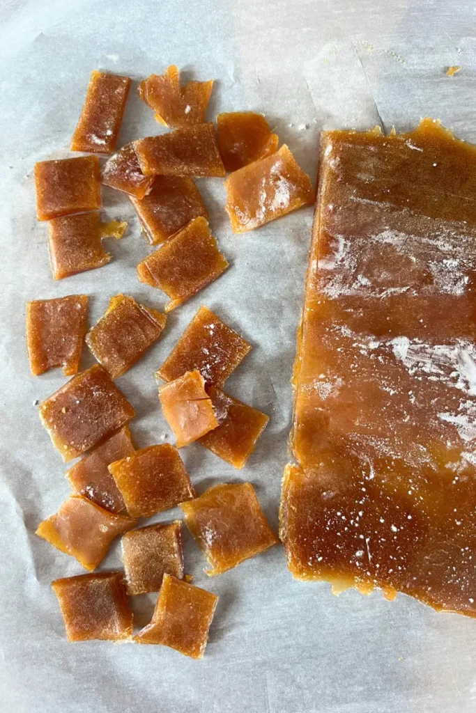 12 Cutting set ginger honey lemon chews into small bite-sized pieces.